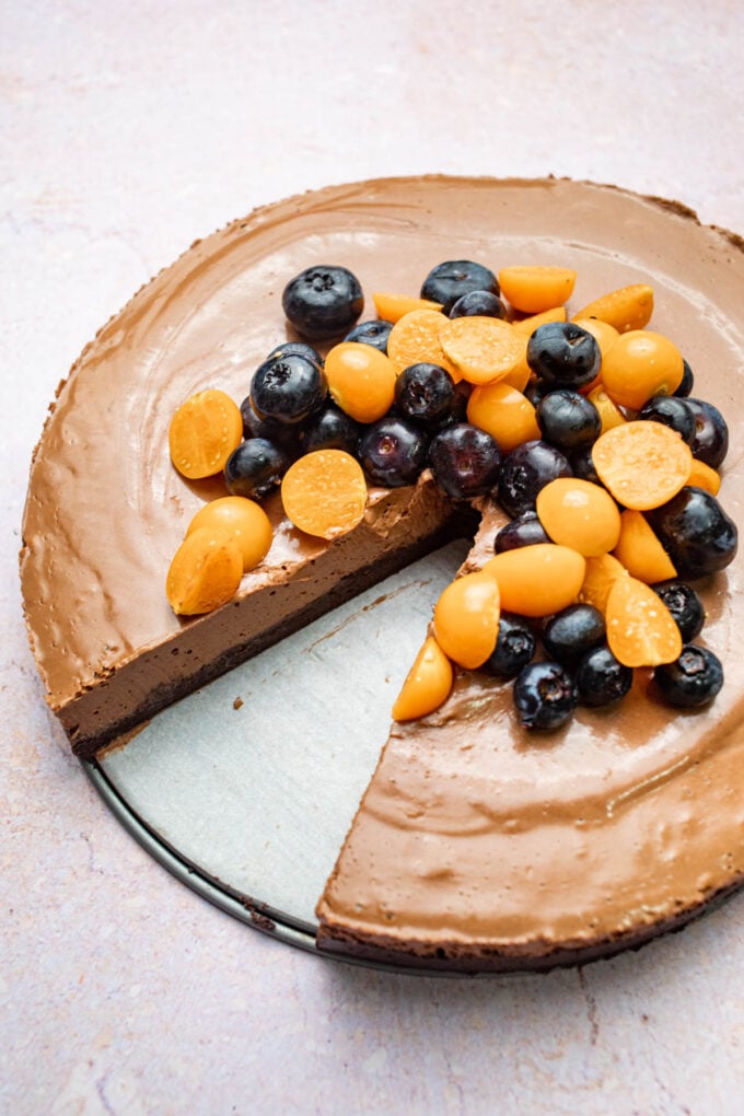 vegan chocolate mousse cake with fruit on top